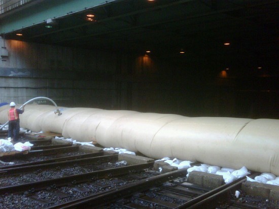 Hurricane Irene preparation: LIRR employees fill an AquaDam with water to help prevent water from flowing into the LIRR's tunnels to Penn Station. Photo by Metropolitan Transportation Authority / Sam Zambuto.
